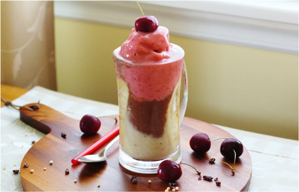 Banana Split Smoothie topped with a cherry.