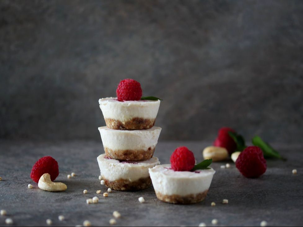 A stack of cashew cups topped with a raspberry